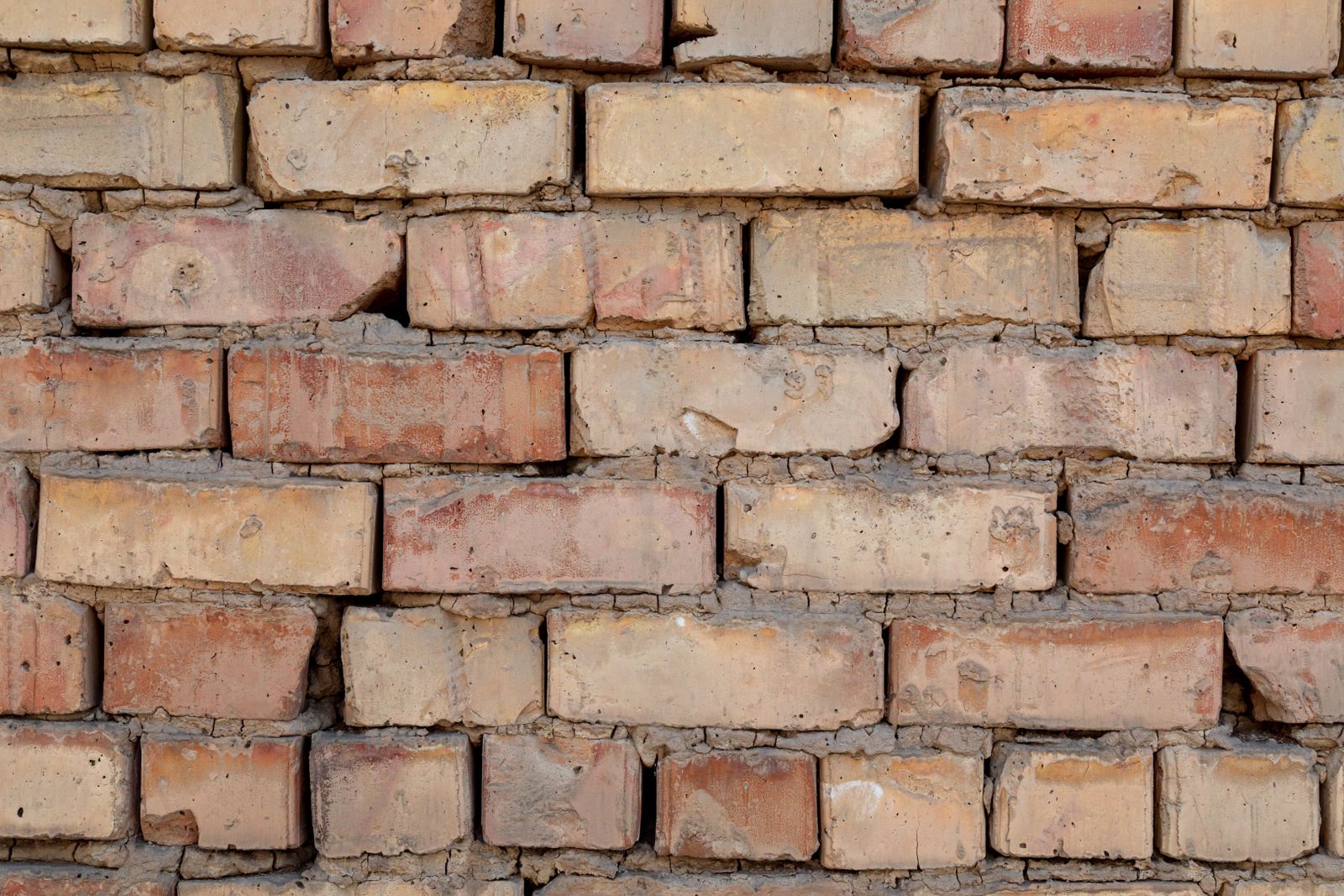 Brick wall with deteriorating mortar joints