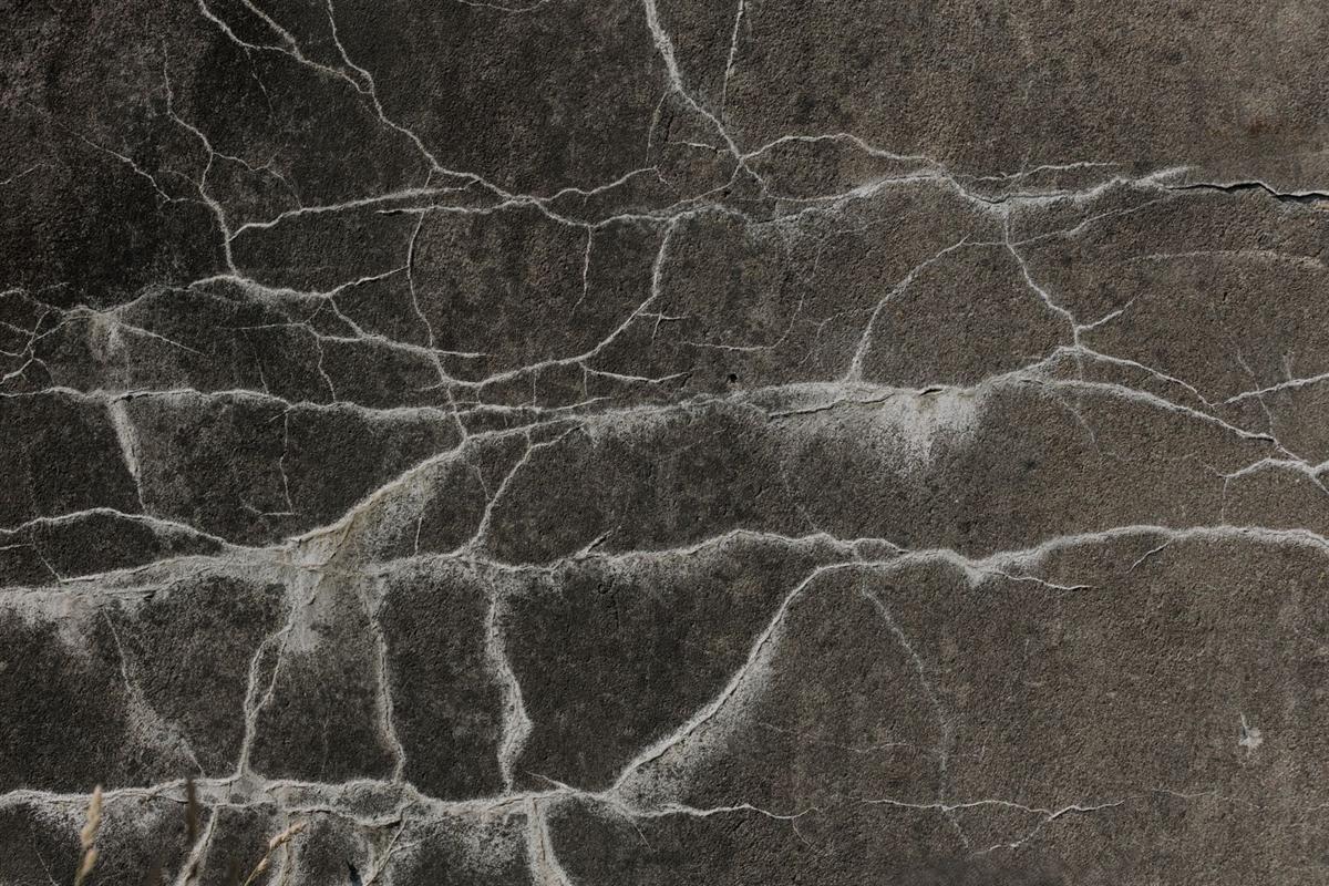 Close view of a crack running through a concrete foundation wall