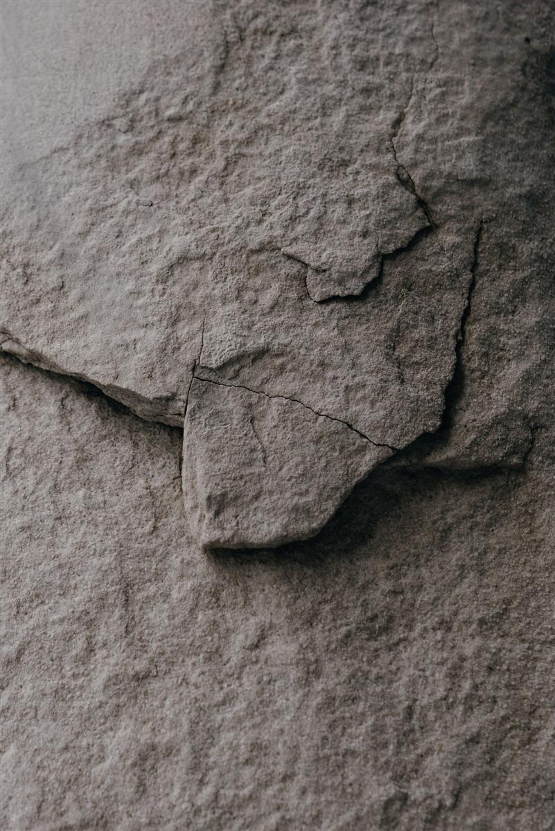 Technician injecting a foundation crack with sealant