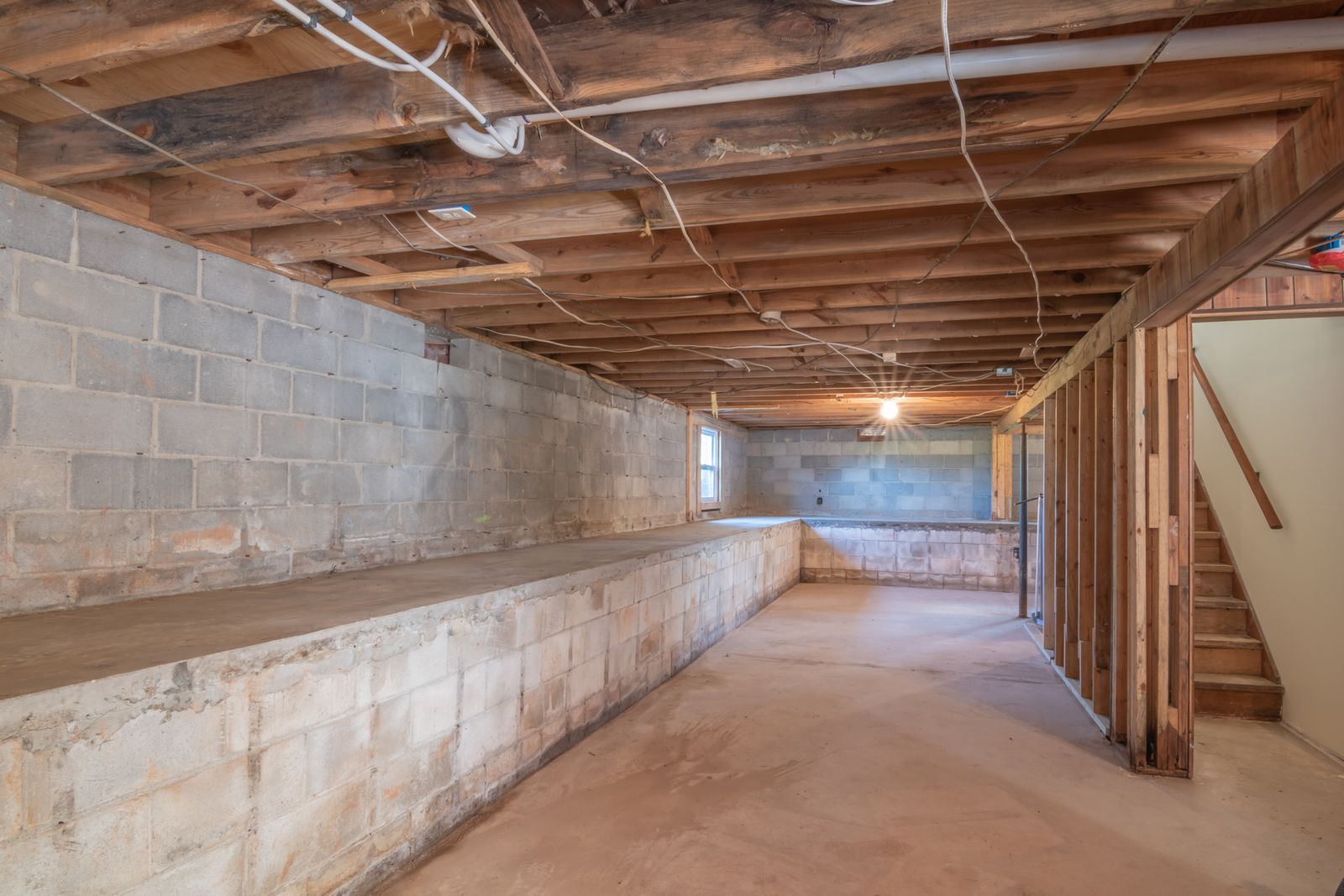 Interior weeping tile installed along a basement floor